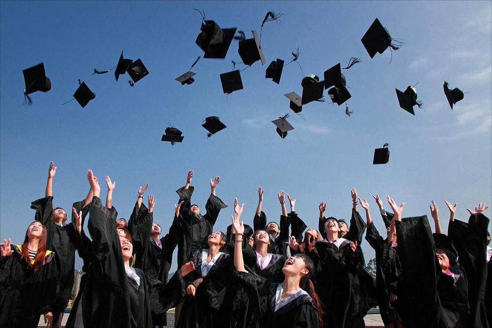 Graduates throwing hats
